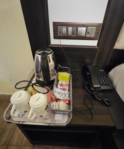 Příslušenství pro přípravu čaje a kávy v ubytování GO-GO Stops Hotel
