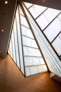 a large skylight in a building with wooden floors at Grand Hyatt Berlin in Berlin