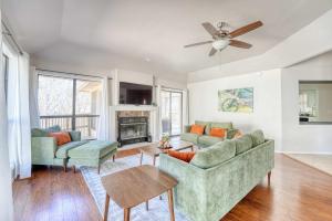 a living room with two couches and a fireplace at Bike & Hike Retreat - Pet-Friendly with Fire Pit in Dug Hill