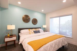 a bedroom with a large bed and a window at Downtown-Elevator-King Bed-Garage Parking-Laundry in Walnut Creek +55 photos