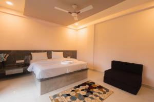 Postel nebo postele na pokoji v ubytování Shreem Resort + 12 fotografií