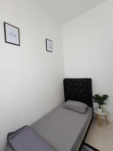 Postel nebo postele na pokoji v ubytování Homestay Jumanji
