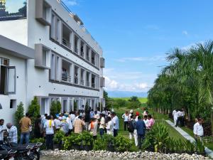 a group of people standing outside of a building at 7Sky Hotel and Restaurant in Bhojpur