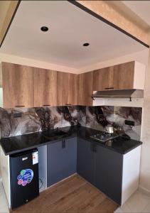 Η κουζίνα ή μικρή κουζίνα στο Appartement luxe 3