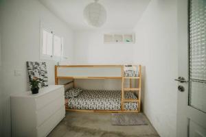 En eller flere senge i et værelse på Casa Ola Tu hogar en Lanzarote