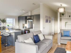 a living room with a couch and a kitchen at The View - Uk36812 in Whalley