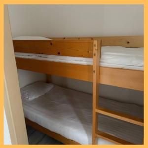 Ένα ή περισσότερα κρεβάτια σε δωμάτιο στο Le Charme du Léman I T2 I centre ville