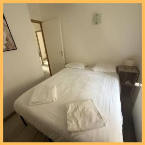 Ένα ή περισσότερα κρεβάτια σε δωμάτιο στο Le Charme du Léman I T2 I centre ville