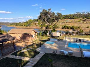 an aerial view of a house with a swimming pool at La Casa Di Mantasoa - Lodge by the Lake in Mantasoa