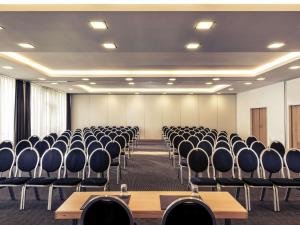 an empty conference room with chairs and tables at Sunday Hotel Bielefeld Johannisberg in Bielefeld