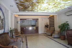 a lobby with a conference room with a gold ceiling at MaxSea Beach Hotel in Bodrum City
