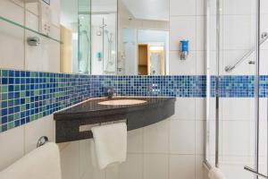 a bathroom with a sink and a shower at Holiday Inn Express Hemel Hempstead by IHG in Hemel Hempstead