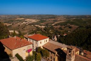 an aerial view of a village with houses and trees at Rocca Contrada in Arcevia +21 photos