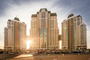 a group of tall buildings in a city at 15-69 Oasis-3 kom in Aktau