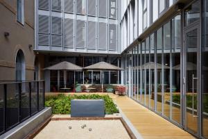 an external view of a building with a courtyard at The Social Hub Toulouse Extended Stay in Toulouse +36 photos