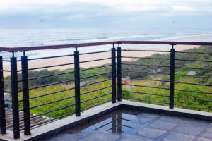 a balcony with a view of the ocean at Pure Bliss Ocean Apartment in Kingsborough