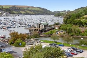 a marina with a bunch of boats in the water at Marina Cottage - Waterside Views Kingswear in Kingswear