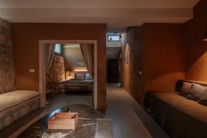 a living room with a couch and a table at MANEJ URLA in Izmir +81 photos