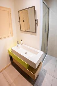 a bathroom with a white sink and a mirror at Authentic Villa 160m2 Lake Vouglans 5min in Charchilla +26 photos
