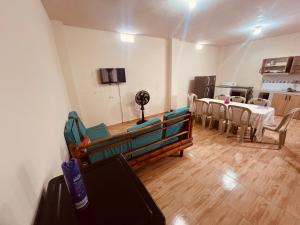 a living room with a couch and a table at Seguridad para la familia in Tena