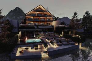 a rendering of a house with a pool and a patio at Vogl's Nest in Fuschl am See