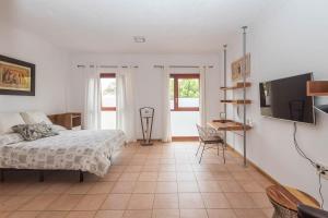 Ένα ή περισσότερα κρεβάτια σε δωμάτιο στο Naranjo House en pleno centro Telde