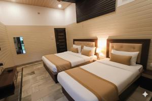 En eller flere senge i et værelse på Mayur Resort + 6 billeder