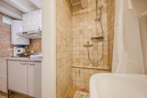 a bathroom with a shower and a sink at Balastro Design Rooms - Venice City Center in Venice