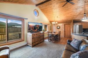 a living room with a kitchen and a dining room at Stapp Mountain Retreat in South Fork, CO in South Fork