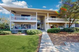a large white house with a rainbow in front of it at Beachwood Villas 7C in Seagrove Beach