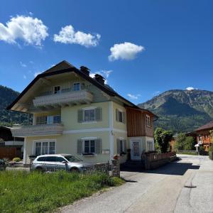 a house with a car parked in front of it at Apartment Brigitte Schöndorfer in Strobl
