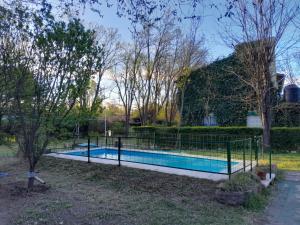 a swimming pool in front of a house at Rafael Arcangel in Nono