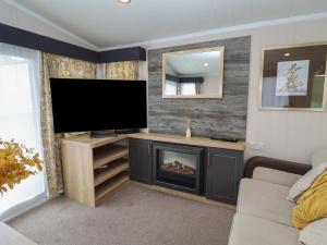 Et tv og/eller underholdning på Stag Lodge, Caravan 70