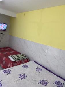 Postel nebo postele na pokoji v ubytování Kitnet espaçosa para casais