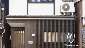 a building with a fan on top of it at WeeklyHouse BiwakoOtsu in Otsu