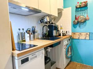 a small kitchen with a sink and a stove at Sea view apartment in Málaga