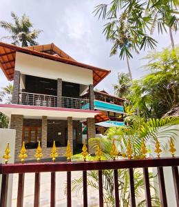 a view of the house from the beach at Happy Buddha Varkala in Varkala