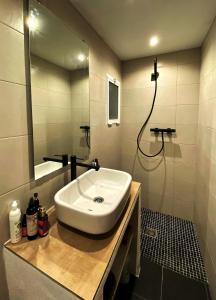 a bathroom with a sink and a mirror at Casa luz in Viñuela