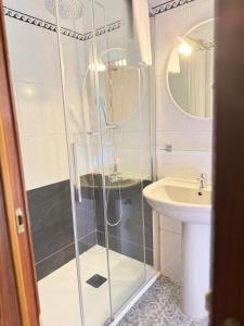 a bathroom with a shower and a sink at HOUSES CASA LA TOSCA The Best views in Tejeda +30 photos