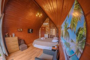 a bedroom with a bed in a wooden room at Oceana Suites Aracaju in Aracaju