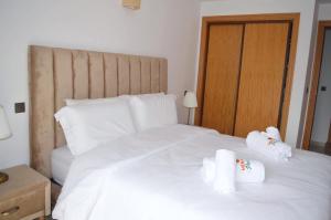 Postel nebo postele na pokoji v ubytování Menara Palms Marrakech