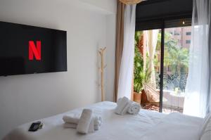 Postel nebo postele na pokoji v ubytování Menara Palms Marrakech