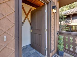 a front door of a house with a porch at Snowflake Chalet in Government Camp +52 photos