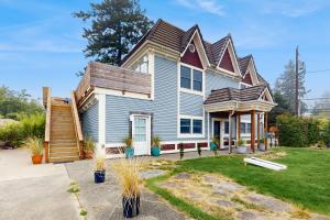a blue house with a gambrel roof at Saltwater Shoreline in Shoreline
