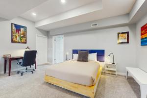 a bedroom with a bed and a desk at Saltwater Shoreline in Shoreline