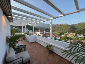 a balcony with a view of the mountains at Atico Benahavis in Benahavís