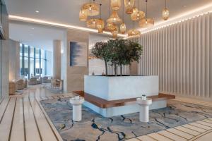 a lobby with a reception desk in a building at Crowne Plaza Yas Island by IHG in Abu Dhabi