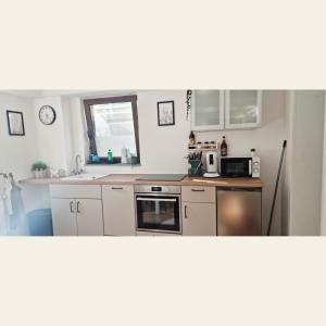 Kuchyň nebo kuchyňský kout v ubytování Ferienwohnung NoLa