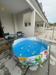 a large inflatable swimming pool on a patio at Landed KLIA Netflix, Fully AC&Heater, Kids Pool in Sepang