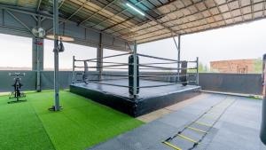 a gym with a bed on the roof of a building at Life resort Marrakech 